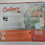 Back of puzzle box with soft pastel tractor images, a male photo and soem descriptive text.