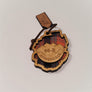 Single Adirondack Park-shaped wood/fabric ornament on a white background. Red plaid fabric shows above and below the center wood carving of mountains with the letters 46-R ADIRONDACK etched on the center wood.