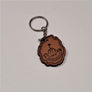Single leather key chain with 46-R ADIRONDACK in brown lettering curved below a mountain top with a flag planted in the center, all within the park outline, attached to a silver chain and keyring.