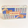 Game box featuring red and black game pieces for 4 In a Row