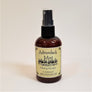Standing brown bottle of Adirondack Mist with pale yellow label facing forward.