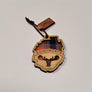 Single Adirondack Park-shaped wood/fabric ornament on a white background. Red plaid fabric shows through the top half with ADIRONDACK etched above the image of a plaid moose head showing through the bottom center.