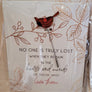 Single Cardinal pin with bird in profile and wings tight on an illustrated card with the words NO ONE IS TRULY LOST WHEN THEY REMAIN IN THE HEARTS AND MINDS OF THOSE WHO LOVE THEM printed in bottom center. All seen through plastic packaging.