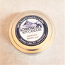 Close up of top of tin cover of 4-ounce Lakehouse soy candle