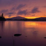 Barry Lobdell image from photo card Late August Sunset--water foreground, mountains background with the smoky sunset coloring the water and the sky
