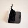 Open rfid powerbank wallet with black accordion section exposed.