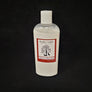 Single bottle of Rustic Cedar Goat Milk Lotion standing straight up. White liquid can be seen through clear plastic around the rectangular label in the center. The label has a rust-colored border with the black tree and goat logo in the center. Above the logo is the text Rustic Cedar Goat Milk Lotion and below in script Rosemary & Peppermint with 8 fl.oz. /236 ml below that.
