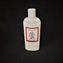 Single bottle of Rustic Cedar Goat Milk Lotion standing straight up. White liquid can be seen through clear plastic around the rectangular label in the center. The label has a rust-colored border with the black tree and goat logo in the center. Above the logo is the text Rustic Cedar Goat Milk Lotion and below in script Goat Yoga with 8 fl.oz. /236 ml below that.