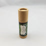 Cardboard lipstick-shaped container of VAPOR RUB standing upright.