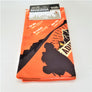 Orange bandana with black mountain range and hiker silhouetted with white and yellow type listing mountains and elevations. Folded as a rectangle with packaging label on top.