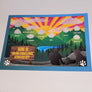 Colorful card with green snow-capped mountains representing the ADK-9 Hiking Challenge which is printed in yellow on a brown sign. A human silhouette and two canine silhouettes' are to the right. The mountains are named with white text inside them: JAY, MOXHAM, MT. VAN HOEVENBERG, FLOODWOOD, SILVER LAKE, BUCK, BAXTER, CASTLE ROCK, and BARONVILLE.