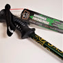 Close up of hiking pole handle--black with black strap and manufacturers tag attached.