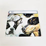 Packaged folded apron with two dog faces showing