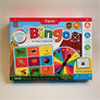 Brightly colored front of Farm Bingo box with a sample card and spinner.