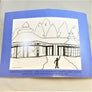 Back cover of book featuring black and white rendition of the outside of the Adirondack Carousel
