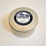 One closed 6-ounce tin of Cozy Home soy candle
