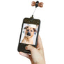 Cell phone with dog picture under the the treat and attachment to the cell phone.