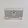 Dionis Goat Milk Bar Soap in its boxed package. Gray top with Dionis circle logo in center above white strip with black type.