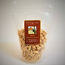 Standing bag of Mapleland Farms Maple Roasted Peanuts with label top-centered and peanuts showing through the clear plastic bag.