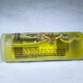 Side view of clear vial of Niawen eye serum on its side to show the purple text which describes how to use it and a list of ingredients.
