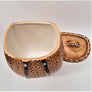 Packbasket cookie jar open with top set flat behind and right of open white inside jar.