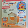 Back of the Bird Feeder kit shows images of the plain wooden frame, 5 small paint containers (blue, white, red, yellow, green and another white), two paint brushes and decals; a picture of a completed feeder and a list of what the set includes is printed on the back.