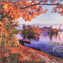 Just the photo from the box cover of the Hornbeck Canoe, Lake George. Purple water and fall-foliage on the land with a red canoe in the water close to the left bank.