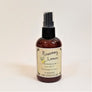 Standing brown bottle of Rosemary Lemon with pale yellow label facing forward.