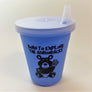 Baby blue sippy cup standing upright with clear top attached
