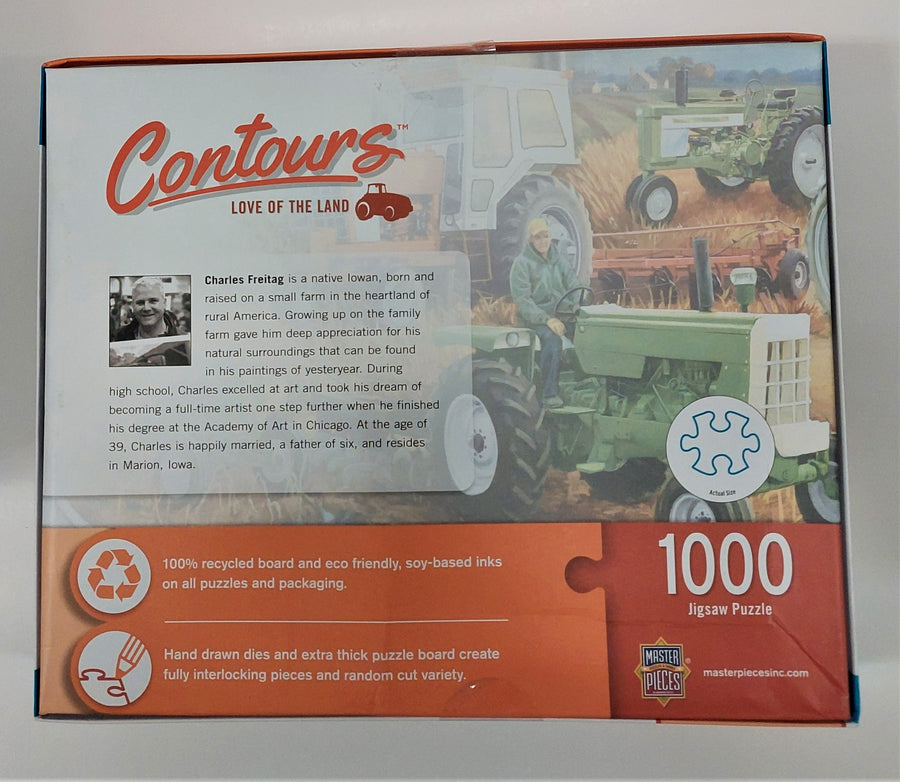 Back of puzzle box with soft pastel tractor images, a male photo and soem descriptive text.