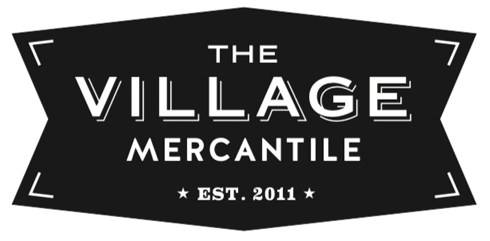 black and white logo of The Village Mercantile in Saranac Lake
