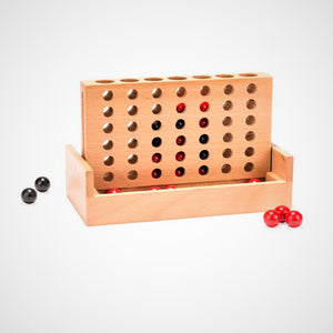 Game itself with upright wooden slotted game board and red and black marbles.