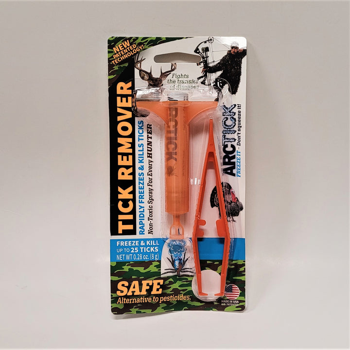 Orange vial and tick remover affixed with plastic wrapping to a display card.  Illustrations include a turkey, a hunter, a deer head. Orange type on the left side says TICK REMOVER. Blue type: Rapidly freezes & kills ticks. Black type: Non-toxic spray for every hunter. White type: Freeze & Kill up to 25 ticks. Orange type on bottom: SAFE Alternative to pesticides.