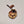 Single Adirondack Park-shaped wood/fabric ornament on a white background. Red plaid fabric shows through the top half with ADIRONDACK etched above the image of a plaid moose head showing through the bottom center.