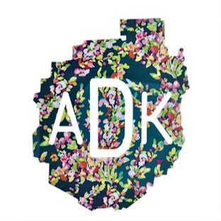 Decal of the Adirondack Park boundaries in navy floral with white ADK lettering centered.