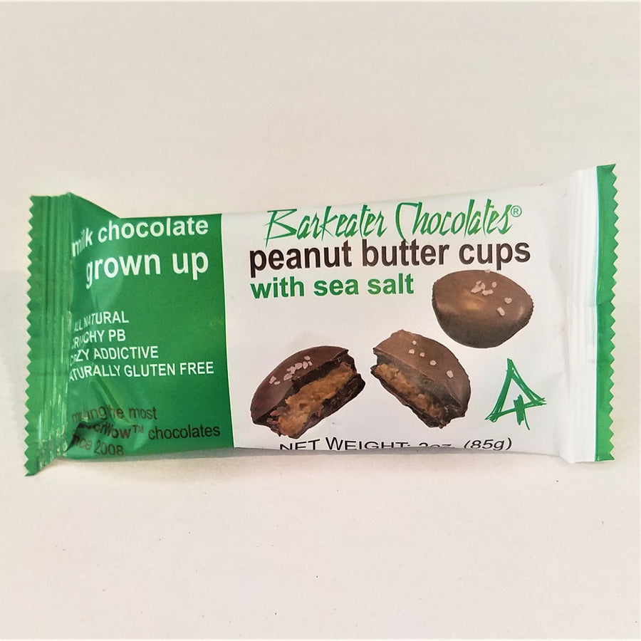 Green and white package of Milk Chocolate Barkeater chocolates peanut butter cups with sea salt. 