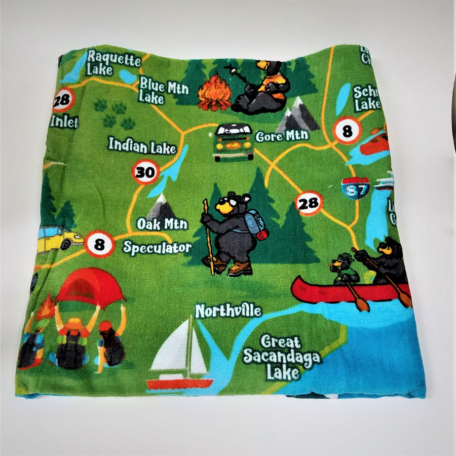 Folded terry cloth towel showing the southeast portion of the Adirondack map in greens, blues and reds with bear canoeists, and bears engaging in other Adirondack activities.
