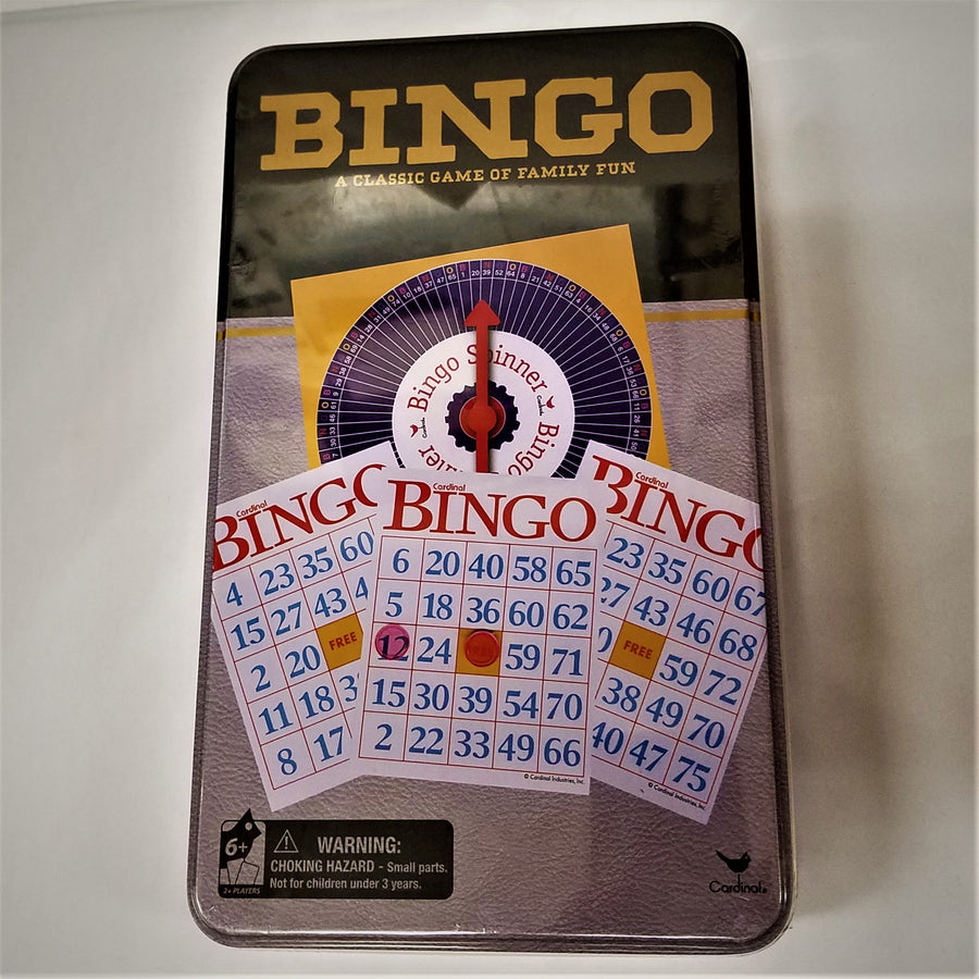 Rectangular tine Bingo game box. Illustrates 3 Bingo cards; a bingo number spinner and the lettering BINGO A Classic of Family Fun