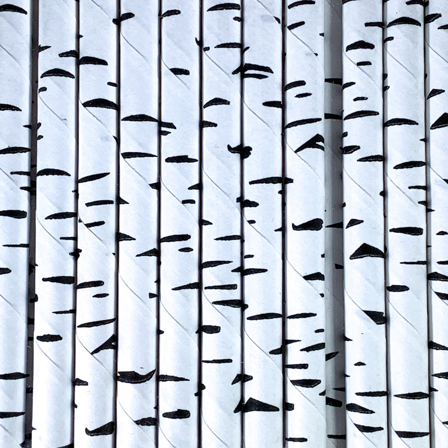Close up of black-and-white paper "birch" straws.