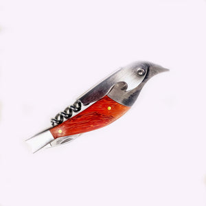 Bird corkscrew with metal head to the right, metal corkscrew part top middle over the body of the reddish brown "body" of the bird, 