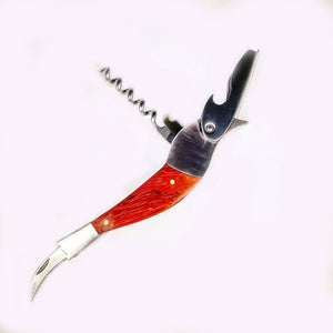 Bird corkscrew opened up to show its features: can opener head on right, corkscrew opened above the "neck" and serrated knife extending out of the "tail".