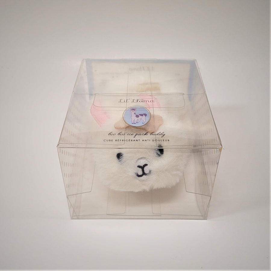 Furry Boo Boo Bunny in its clear plastic packaging box. The black eyes, white and black noes, and pale pink ears can be seen through the packaging.
