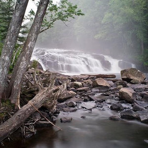 Photo card cover of Barry Lobdell's Buttermilk Falls--tree-lined waterfalls and river rocks