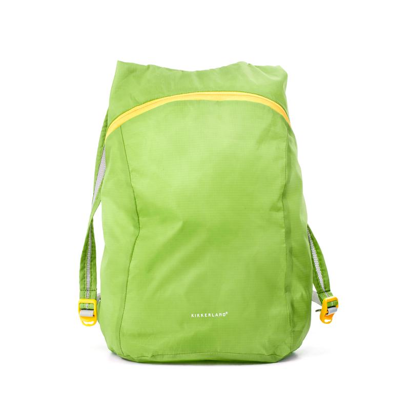 Green compact backpack fully open with yellow zipper line at the top.
