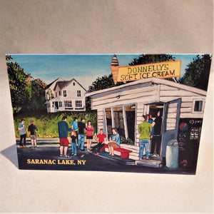 The print of the iconic ice cream stand, Donnelly's, as the cover of a greeting card. White stand and house behind with people in solid colors ordering and eating.
