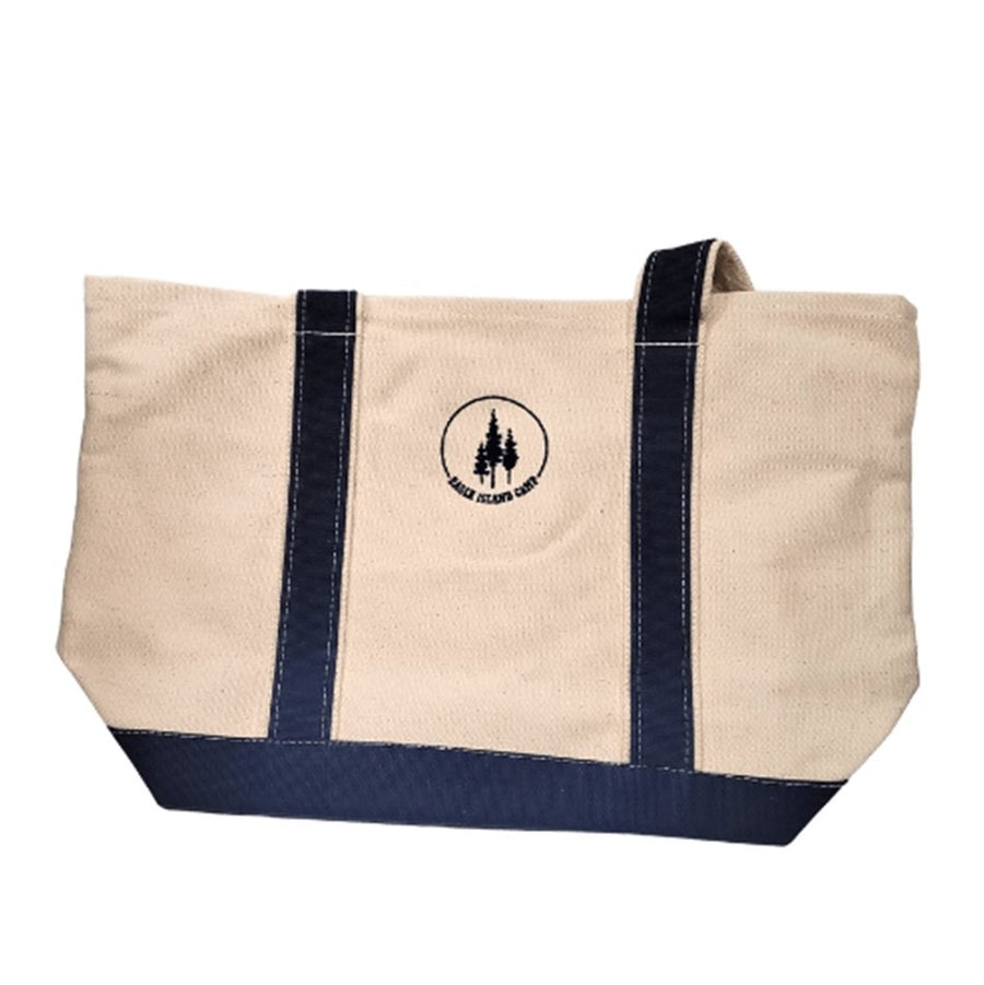 Canvas tote with navy blue straps and bottom panel. Centered between the straps is the Eagle Island Camp logo with 3 pine trees centered in a blue arc with the EAGLE ISLAND CAMP lettering filling the circle.