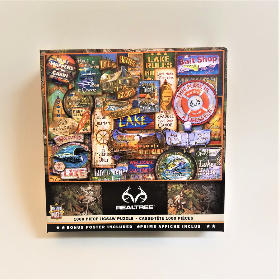 Box cover of the 1000 piece jigsaw puzzle featuring a colorful collage of lake decals and sayings.