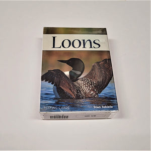 Box of Playing Cards with image of loon with spread wings on water below a white bar with black typle: Loons