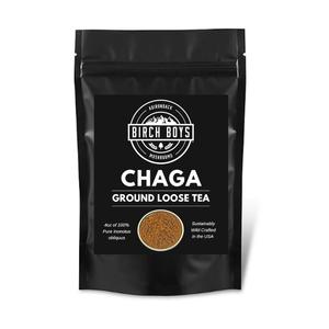 Front of Chaga Ground Loose Tea package. Black with white lettering and a picture of the tea in a round in the bottom center.