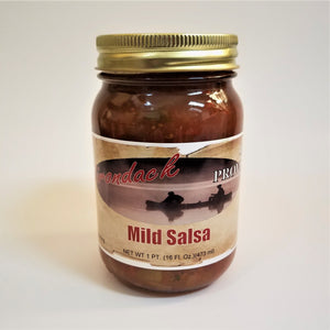 Glass jar of Mild Salsa. Red sauce with glimpses of seeds and pepper can be seen through the glass under the gold screw top.